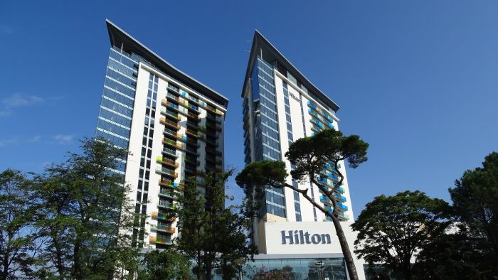 earn frequent flyer miles staying at the Hilton