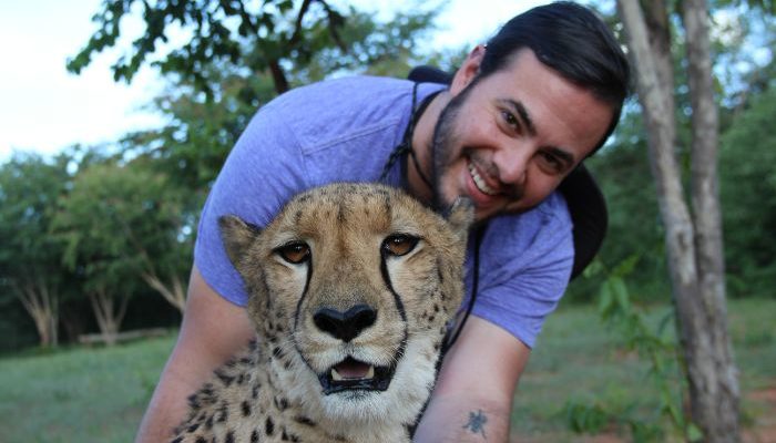 Ben hugging a cheetah