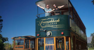a couple of people standing on a trolley