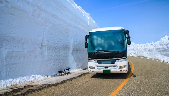 bus on snowy road in Japan