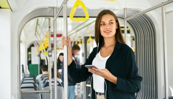 girl listening to music on a bus