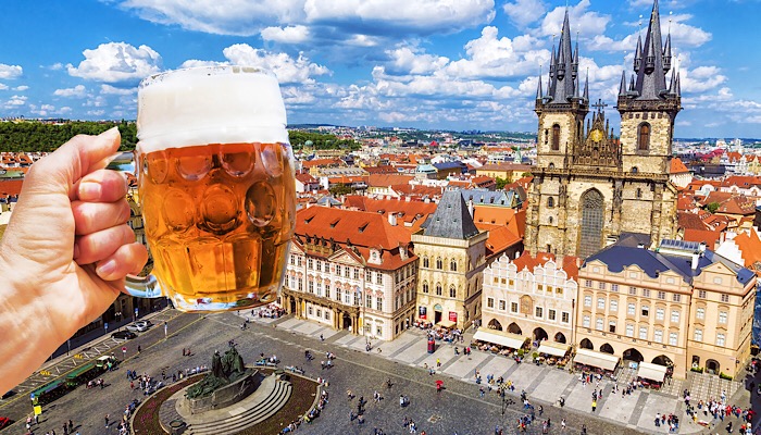 a glass of beer above a city