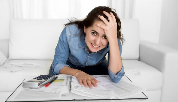frustrated lady looking at finances