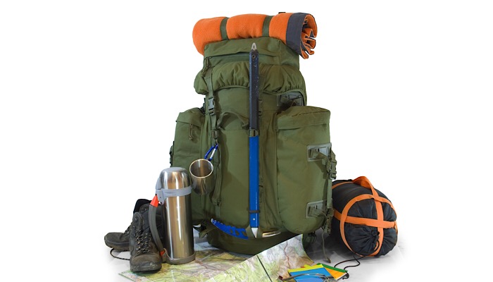 a backpack with a map and other items
