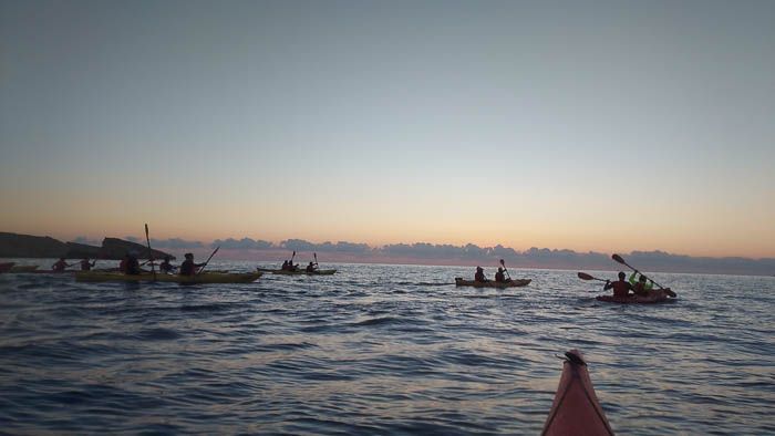 Dawn on the sea with kayaks