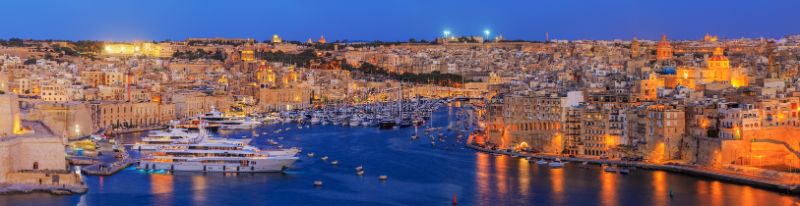 The Three Cities at night from Valletta