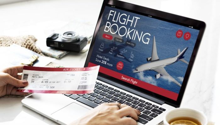 Laptop and flight booking page