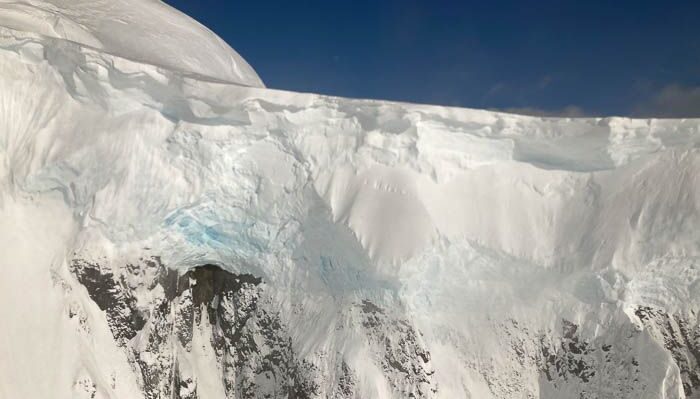 Ice clinging to the cliffside in Antarctica