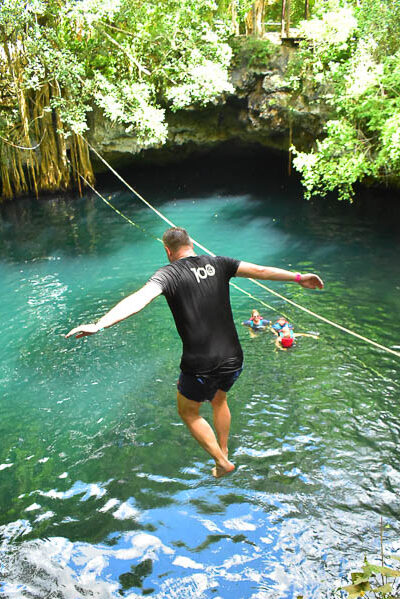 Jason jumping into the cenotes of the Yucatan