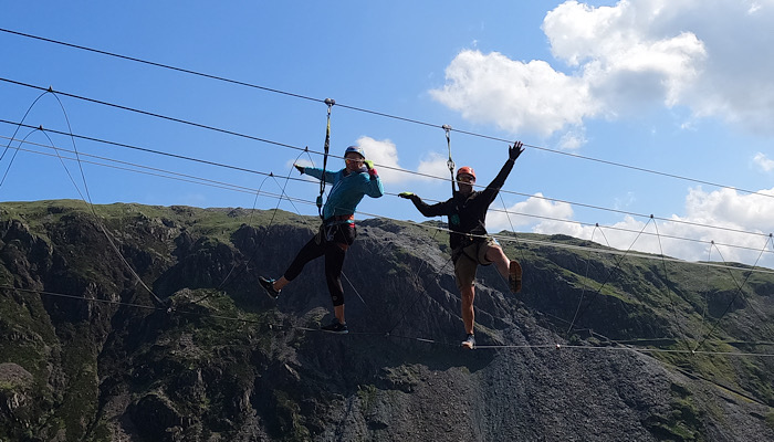 a couple of people on a rope