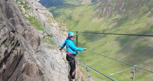 me wearing a helmet and climbing gear on a cliff