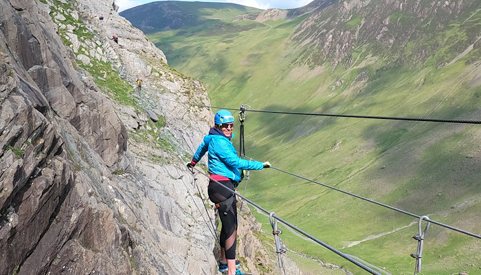 me wearing a helmet and climbing gear on a cliff