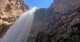 a waterfall in the mountains