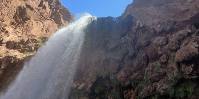 a waterfall in the mountains