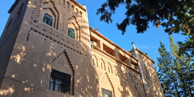 a building with a tree in the background