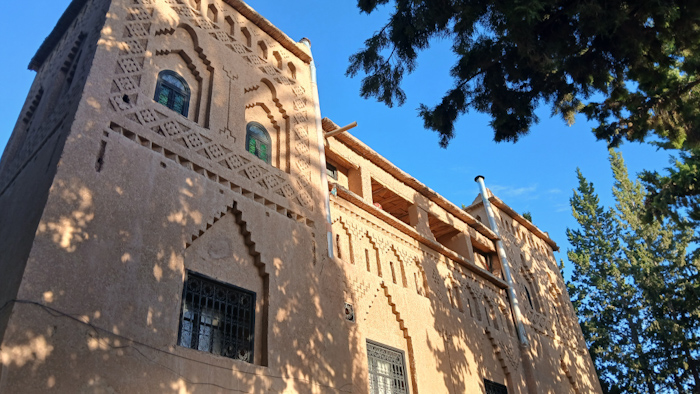 a building with a tree in the background