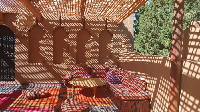 a patio with a table and chairs