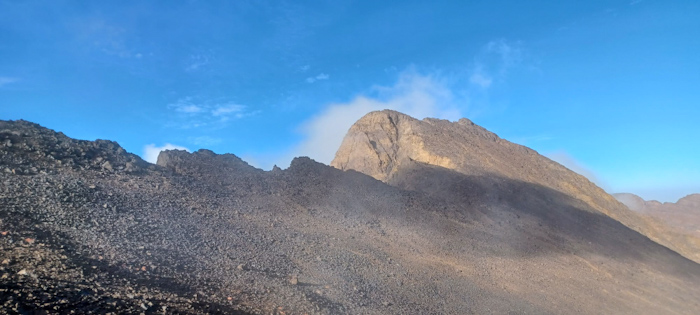 a mountain with smoke coming out of it